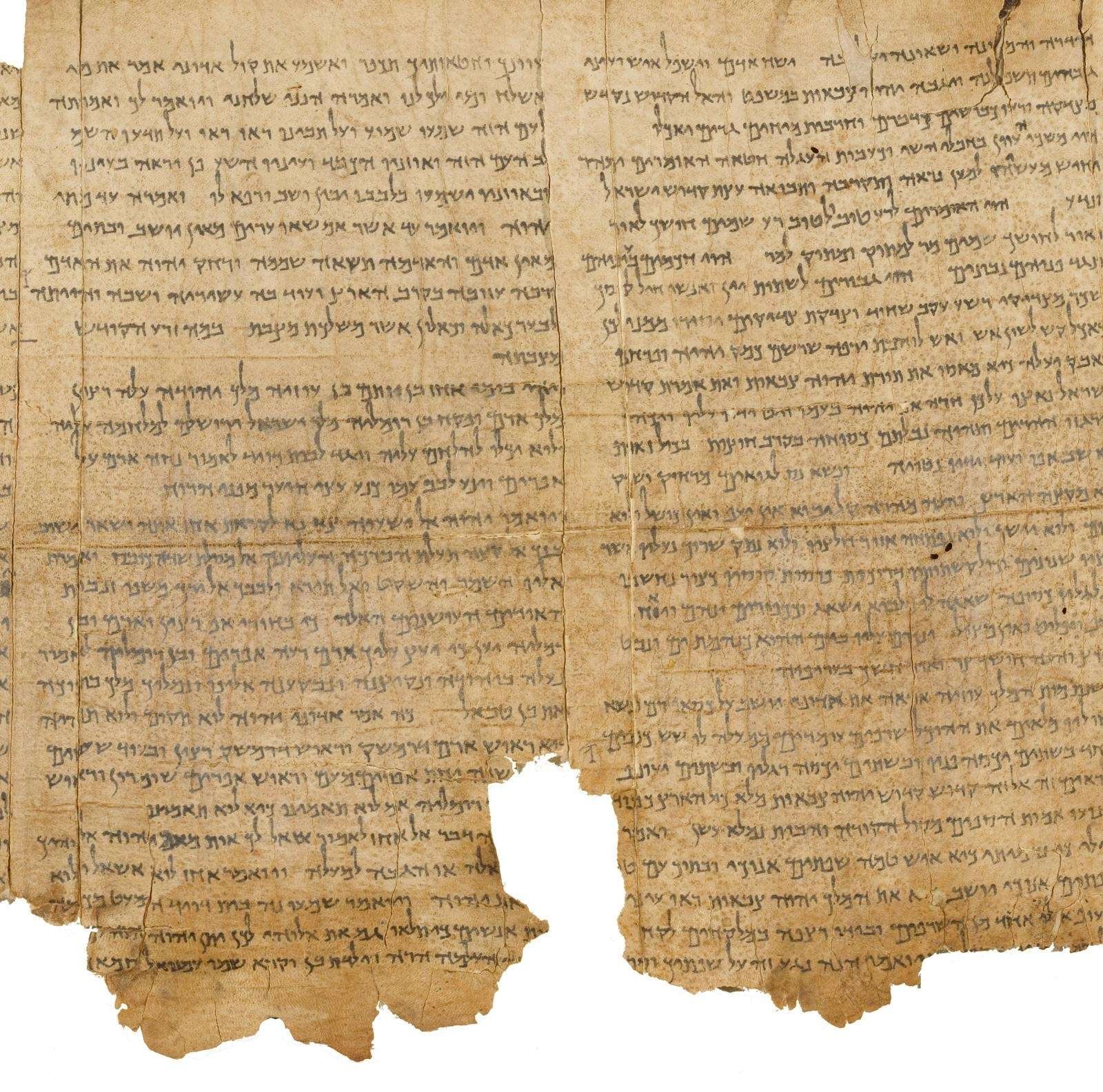 The Great Isaiah Scroll from Qumran Cave 1, copied in the second or first century BC, about a thousand years before the Leningrad Codex. The right-hand column runs into Isaiah 6 (the line qādôš qādôš qādôš sits low in it); the left opens at 6:8, “Whom shall I send?”