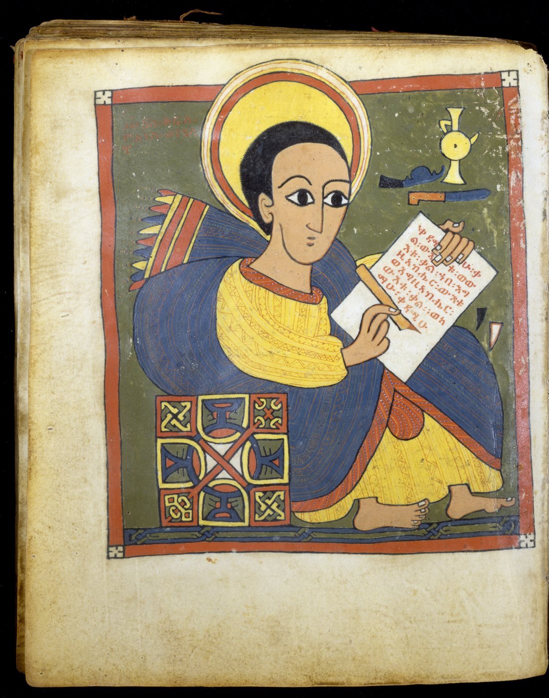 John the Evangelist at his writing desk, from the Gunda Gunde Gospels. Ethiopian scribes wrote and painted books like this one in monasteries in the northern highlands.