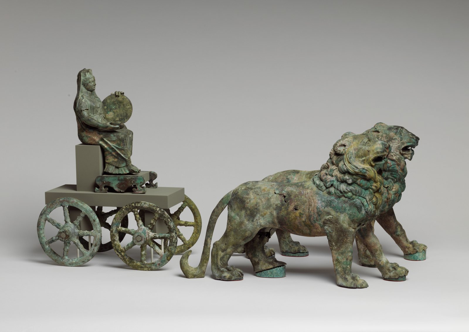 Roman bronze group from a fountain, second half of the 2nd century AD. Cybele, the Mother of the Gods, sits on a cart drawn by two lions, holding a libation bowl and a large drum.