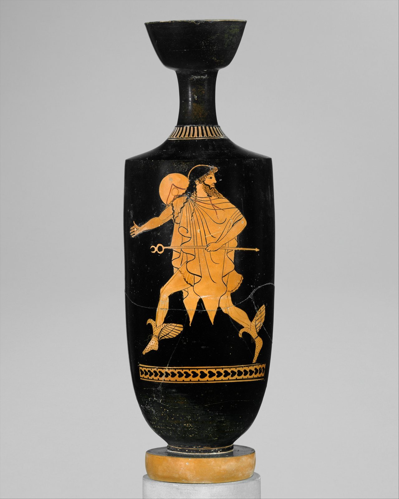 Athenian red-figure oil flask, about 480 to 470 BC, attributed to the Tithonos Painter. Hermes, messenger of Zeus, hurries along on winged boots, holding his herald's staff and wearing a traveler's hat and cloak.