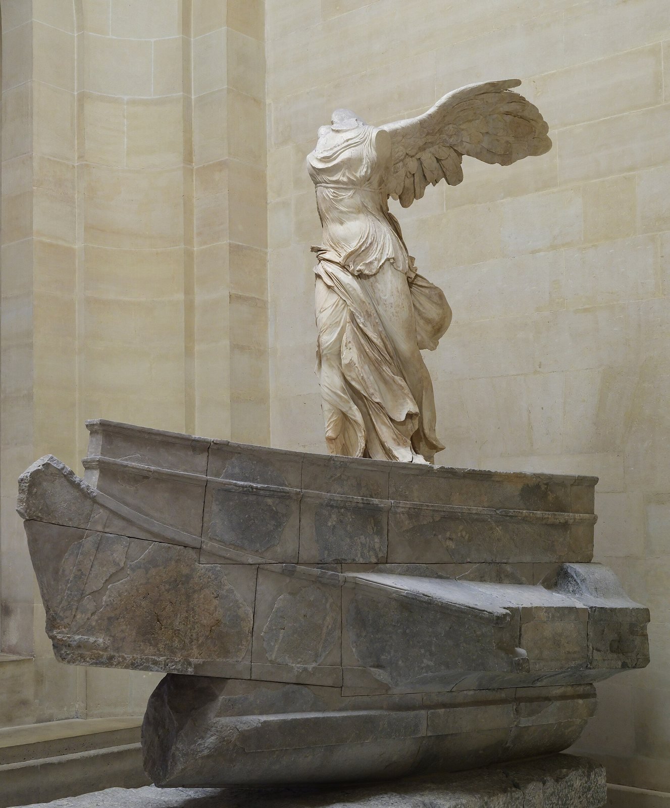 Victory of Samothrace, Greek marble, about 190 BC. The winged goddess Nike, Victory, alights on the prow of a stone warship with her robes pressed against her body by the wind; the monument stood in the sanctuary of the Great Gods on Samothrace.