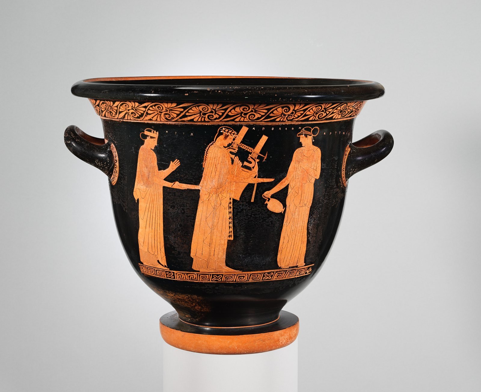 Athenian red-figure mixing bowl, about 460 to 450 BC, attributed to the Villa Giulia Painter. Leto, on the left, stands with her twins Apollo, who holds his lyre, and Artemis, who holds a jug; each is labeled by name.