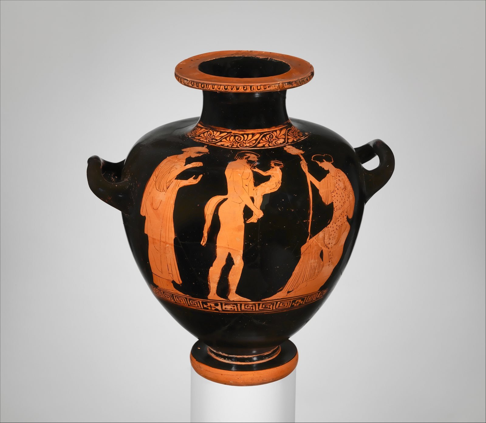 Athenian red-figure hydria, about 460 to 450 BC, attributed to the Villa Giulia Painter. A satyr holds up the young Dionysus between two women, the nymphs who raised the god on Mount Nysa.