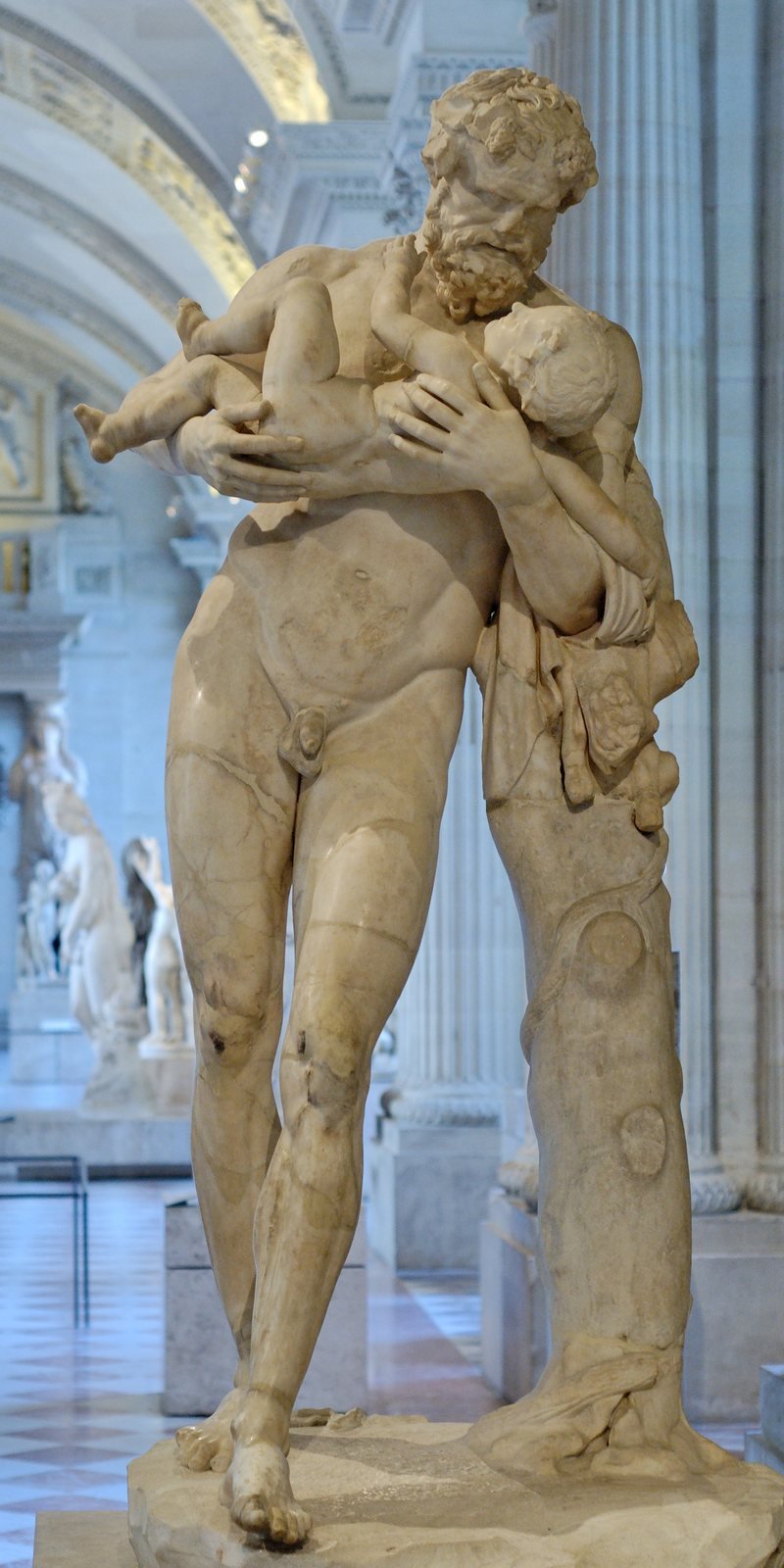 Roman marble statue, 1st to 2nd century AD, after a Greek original of the late 4th century BC. Silenus, the foster-father of Bacchus, cradles the infant god in his arms.