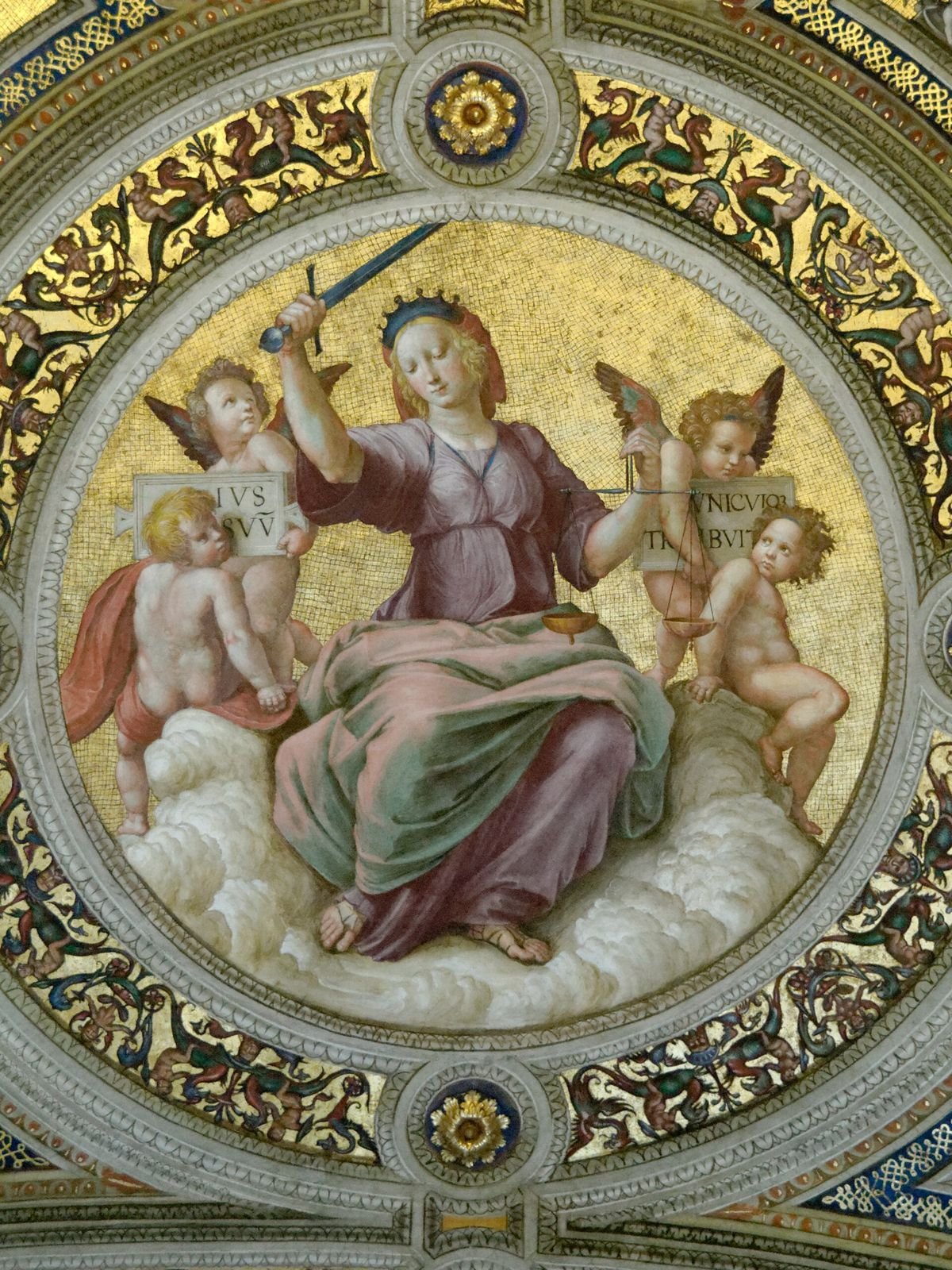 Raphael, Justice, 1508 to 1511. Fresco on the ceiling of the Stanza della Segnatura in the Vatican. Justice sits among the clouds with a sword in one hand and a pair of scales in the other.