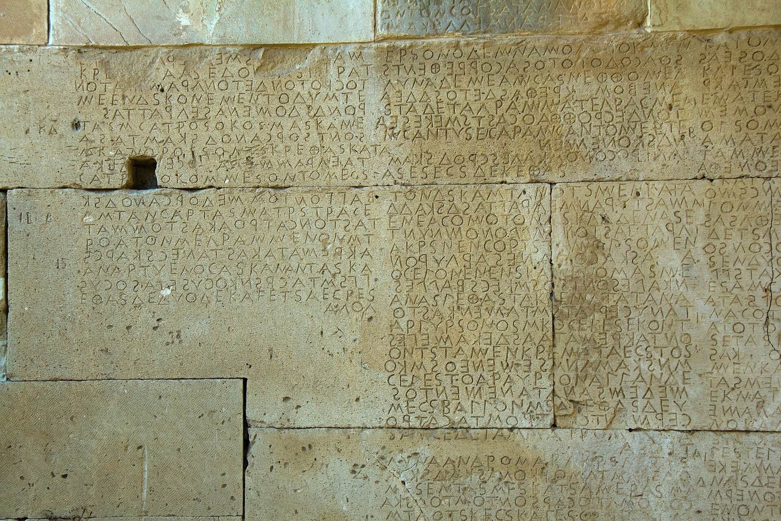 No ancient image of Nomos, the god of law, survives. These lines belong to the law code of Gortyn on Crete, cut in stone about 450 BC, and they run one way and then back again, as an ox ploughs a field.