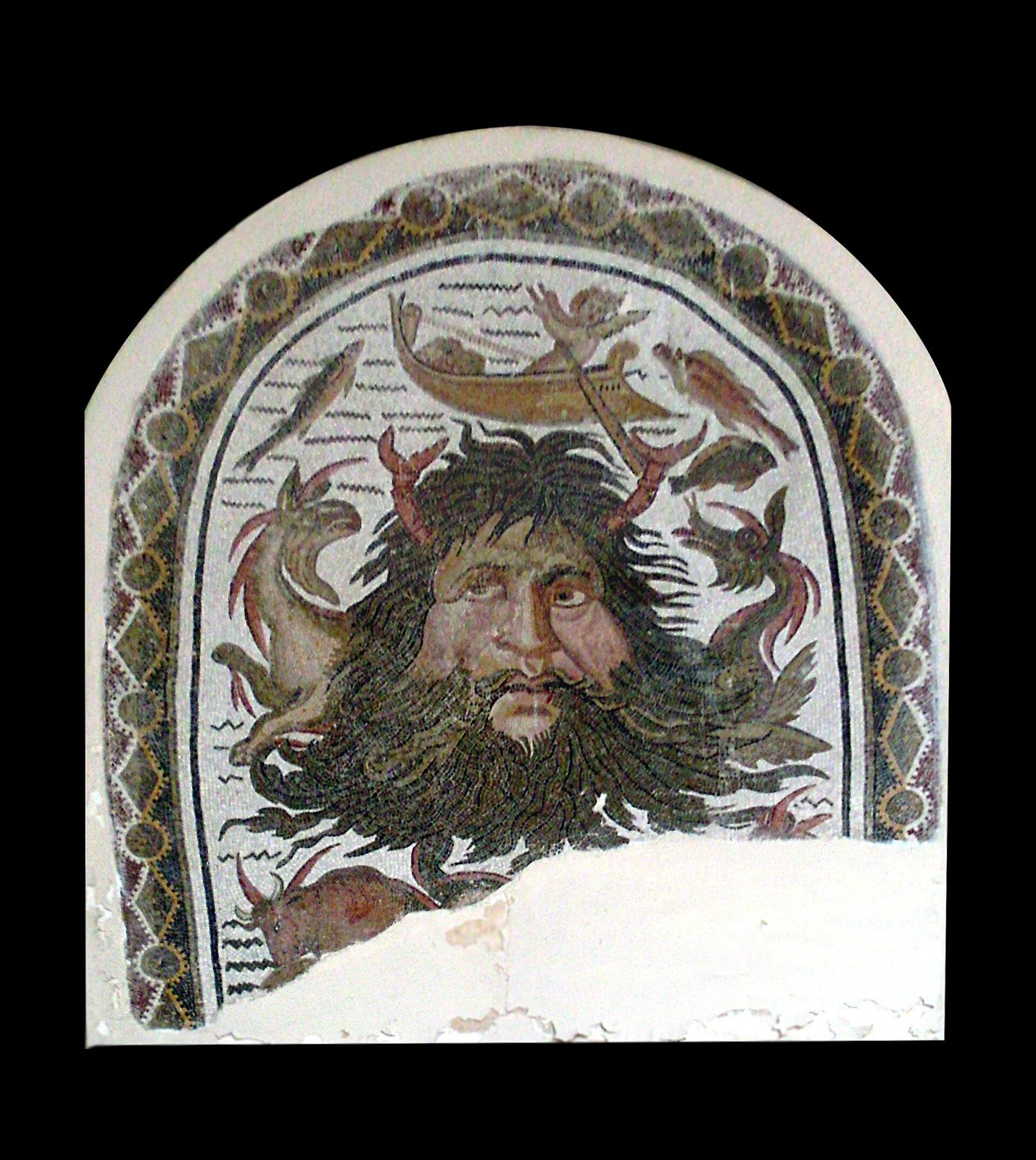 Roman mosaic from Acholla in Tunisia. Ocean rises from the sea with claws sprouting from his hair and a long beard like flowing water, among sea creatures and a small fishing boat.